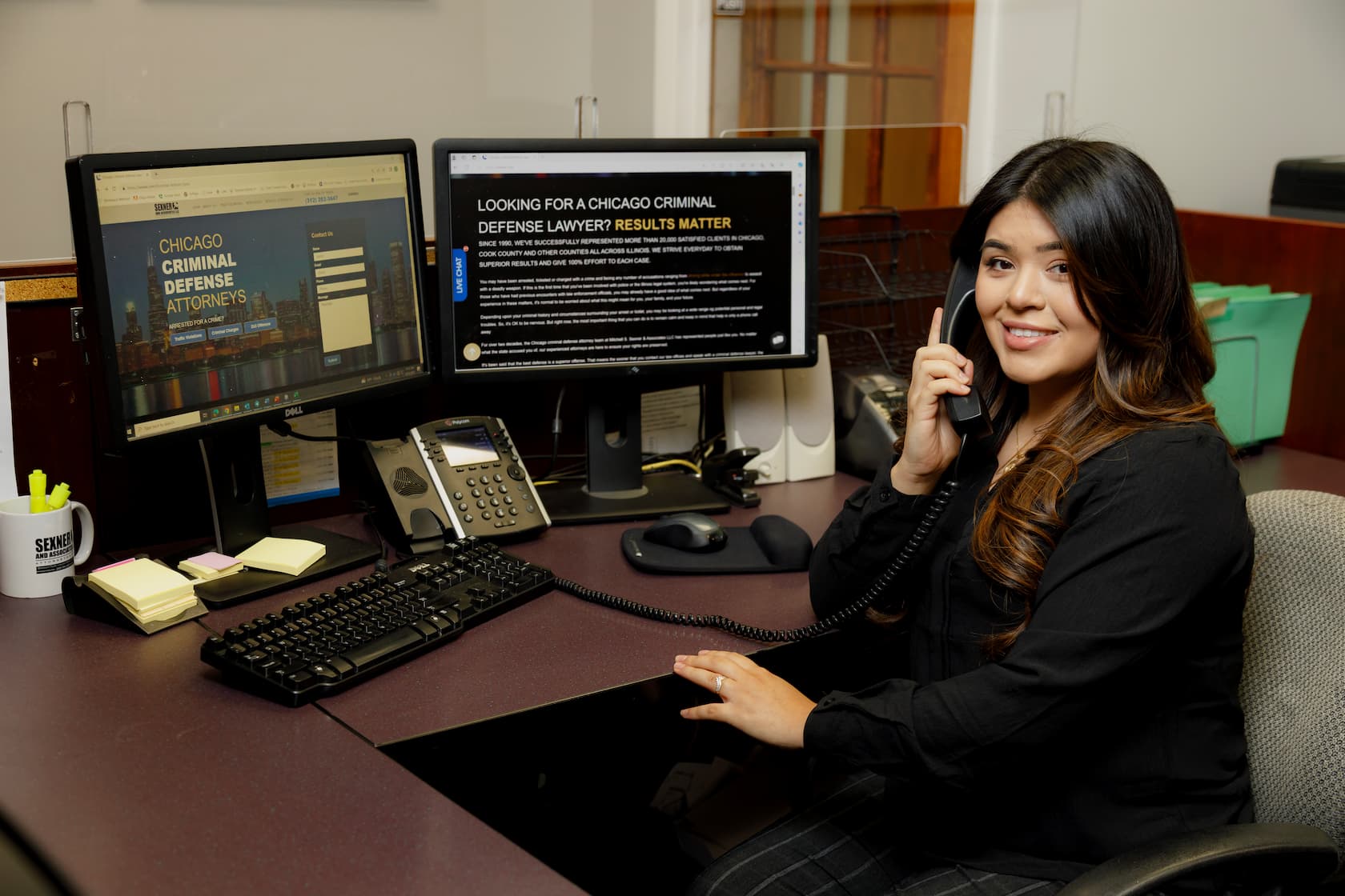 Secretary behind desk